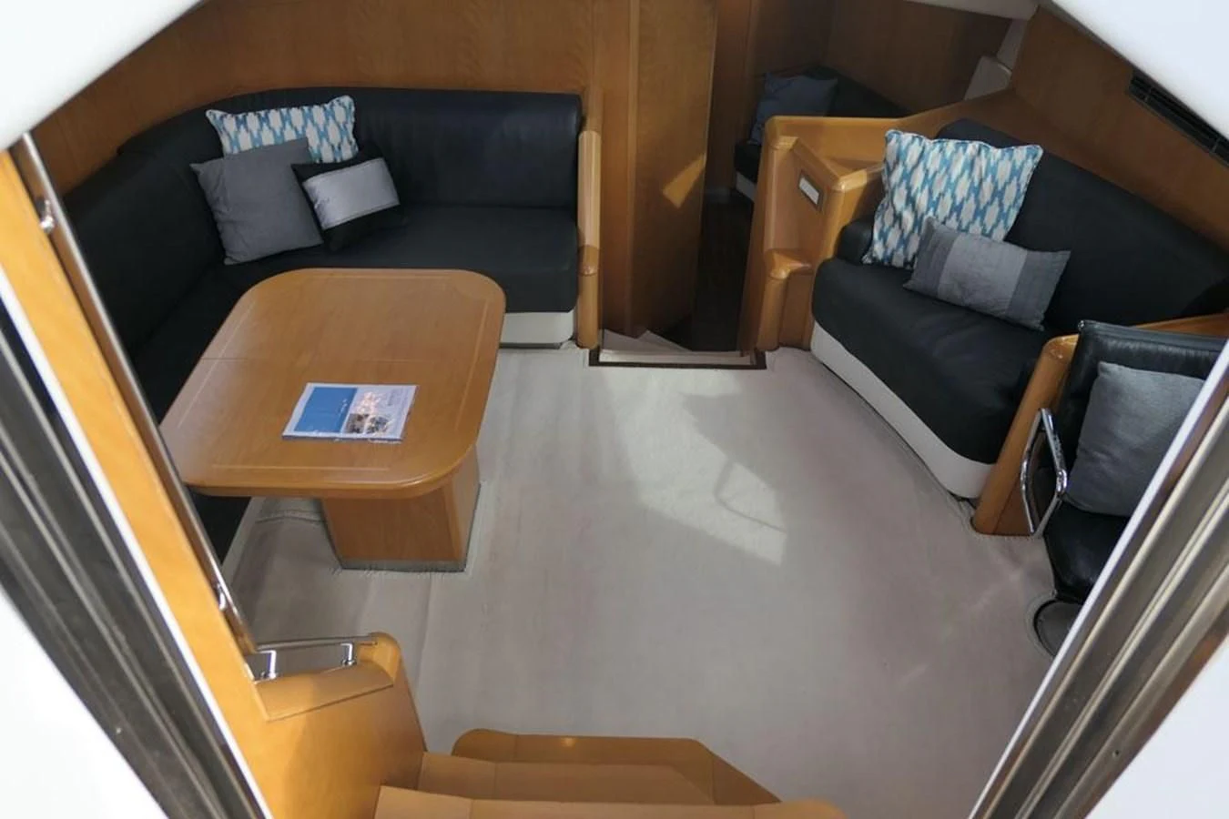a living room with a couch and a table aboard LA LUNA Yacht for Sale