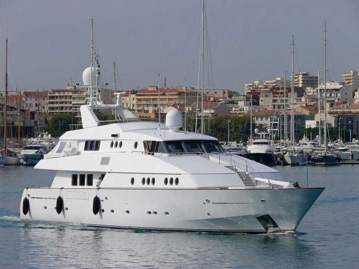 a white yacht in a harbor aboard CAROLINE SEA II Yacht for Sale
