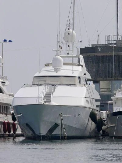 a large white boat in a harbor aboard CAROLINE SEA II Yacht for Sale