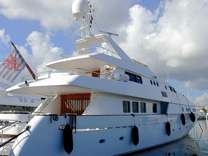 a large white boat with flags aboard CAROLINE SEA II Yacht for Sale