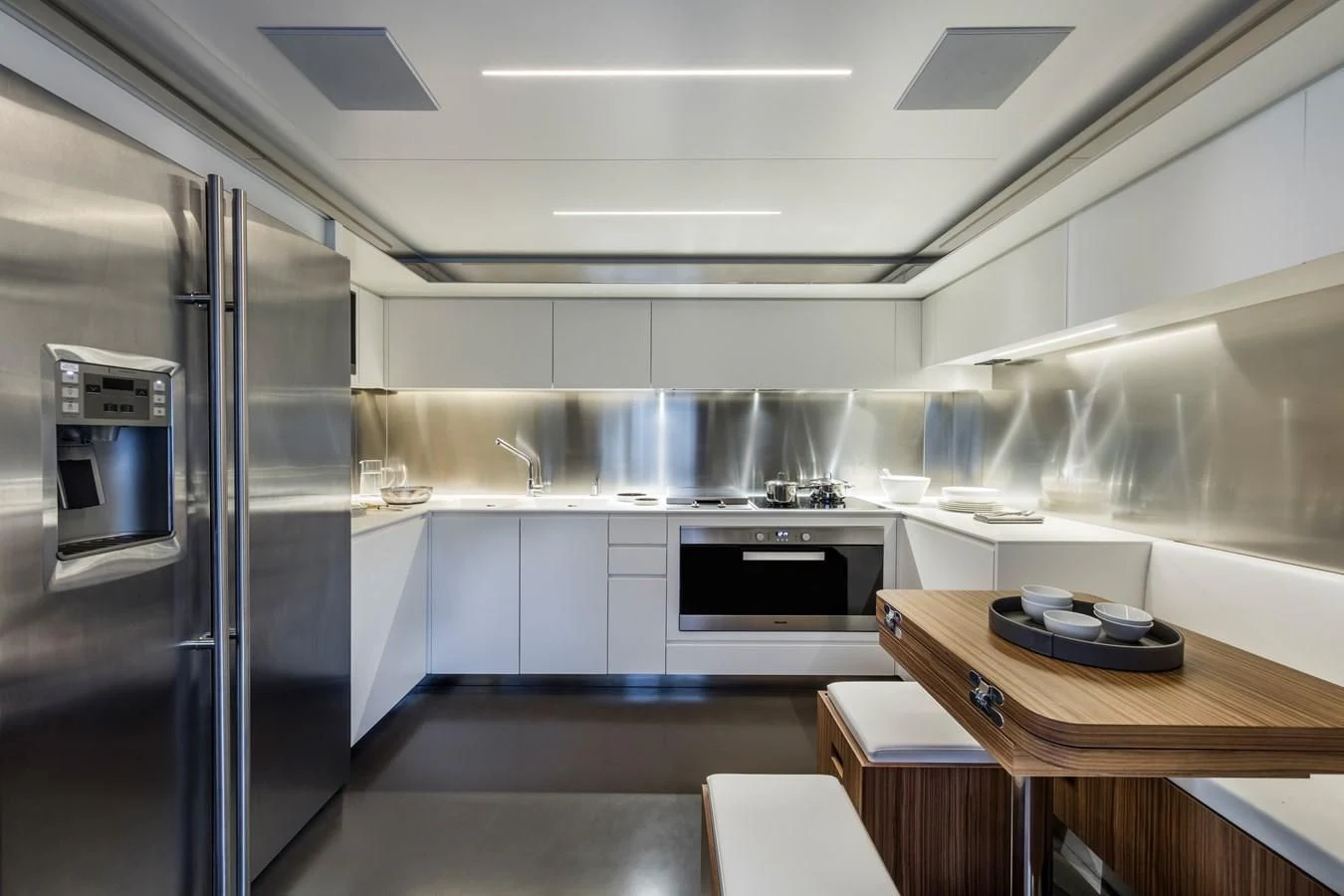 a kitchen with a glass door aboard IRON GRYPHON Yacht for Sale