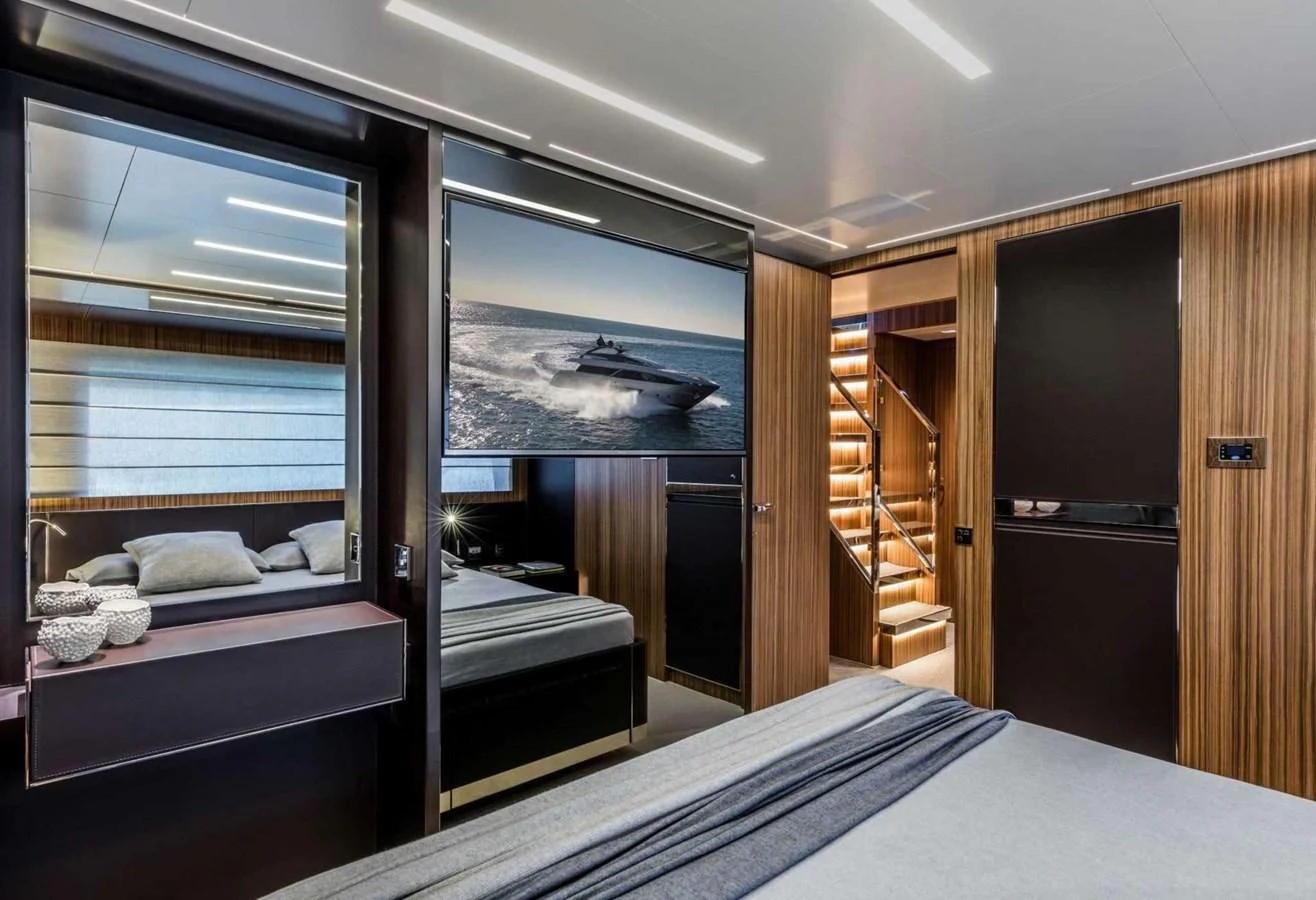 a room with a bed and a window aboard IRON GRYPHON Yacht for Sale