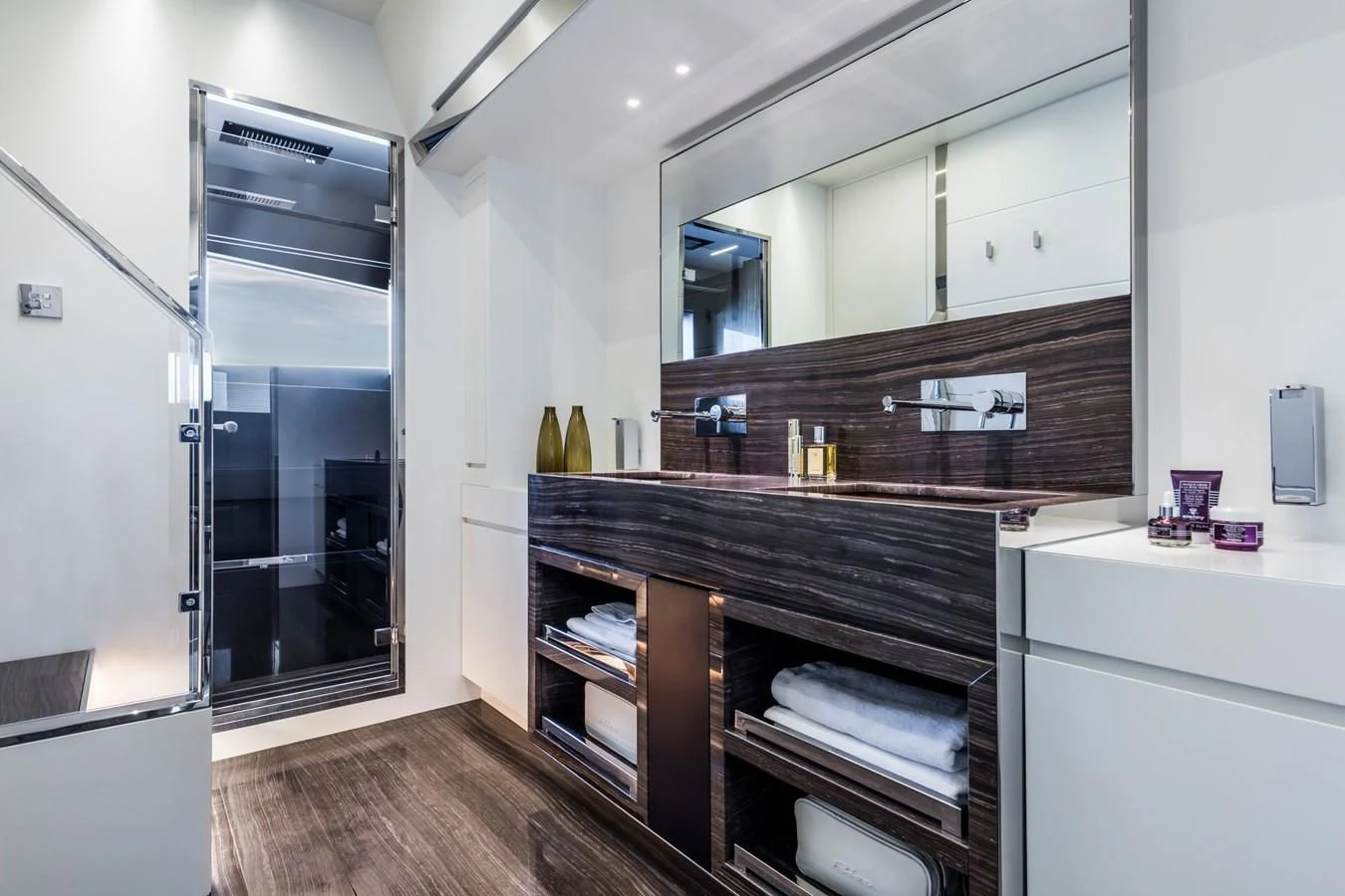 a room with a glass door aboard IRON GRYPHON Yacht for Sale