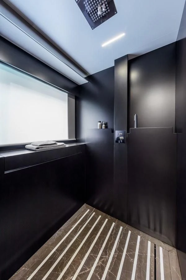 a room with a large window and a tile floor aboard IRON GRYPHON Yacht for Sale