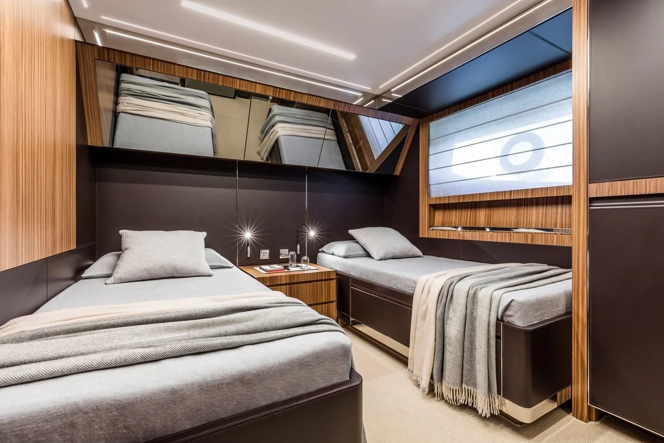 a room with two beds aboard IRON GRYPHON Yacht for Sale