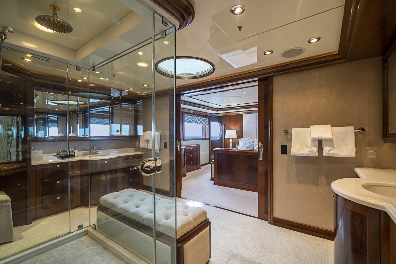 a bathroom with a glass shower aboard CAMILLE Yacht for Sale