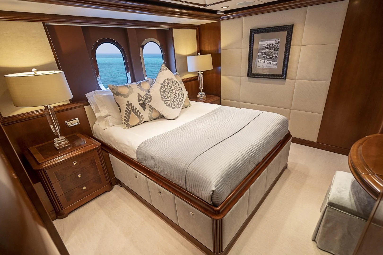 a bedroom with a bed and a window aboard CAMILLE Yacht for Sale