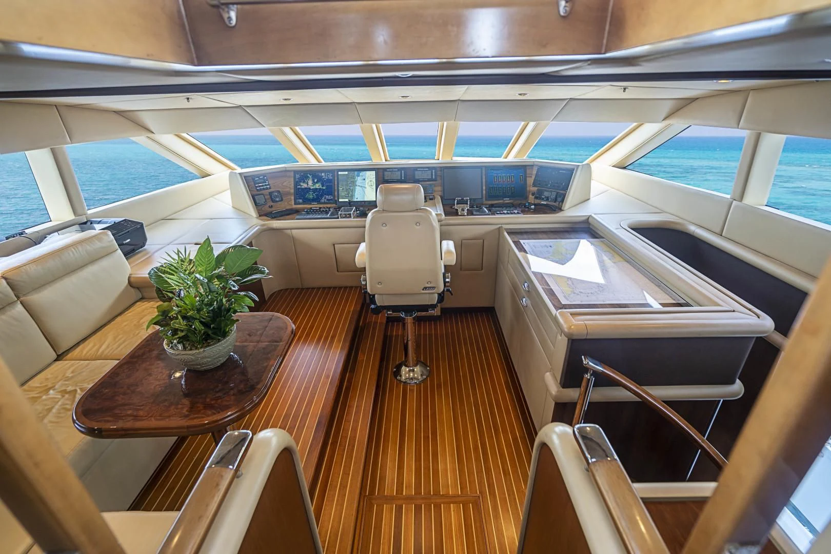 a room with a table and chairs aboard CAMILLE Yacht for Sale