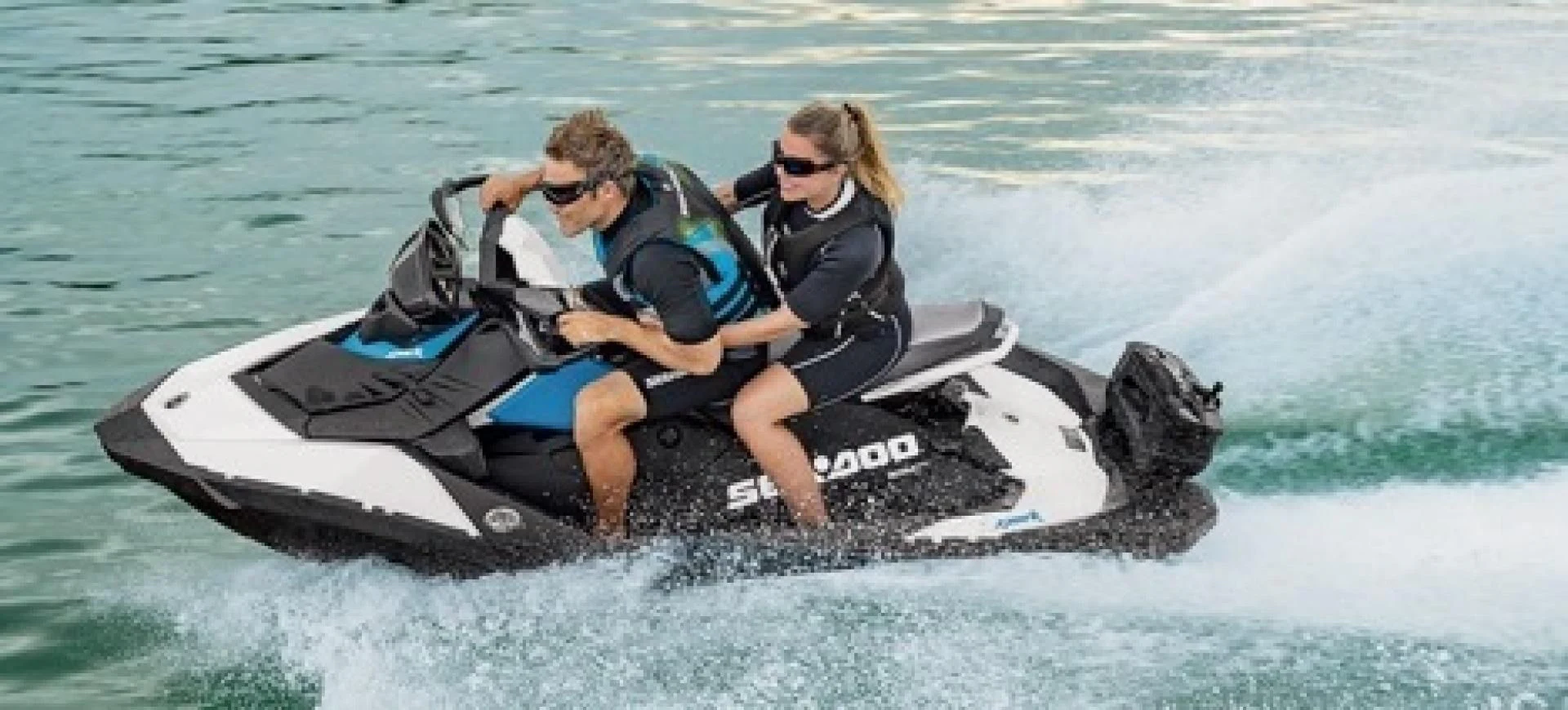 a man and woman on a jet ski in the water aboard CAMILLE Yacht for Sale