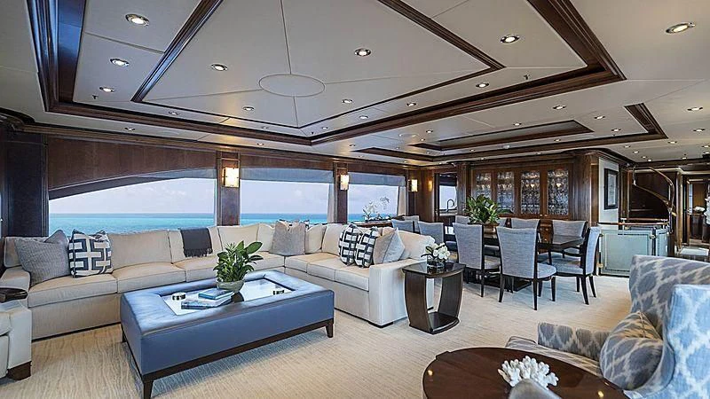 a living room with a large window aboard CAMILLE Yacht for Sale