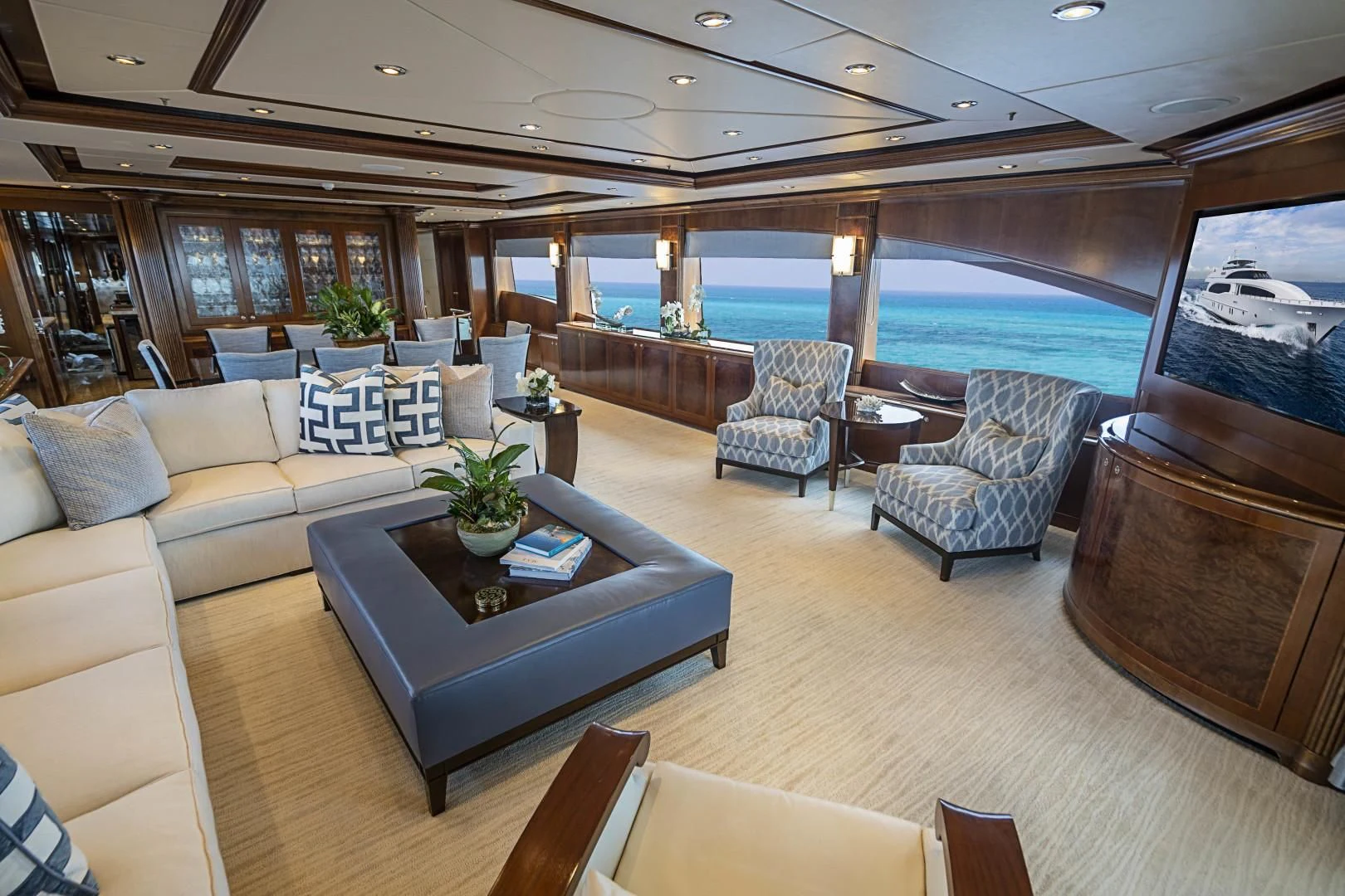 a living room with a large window aboard CAMILLE Yacht for Sale