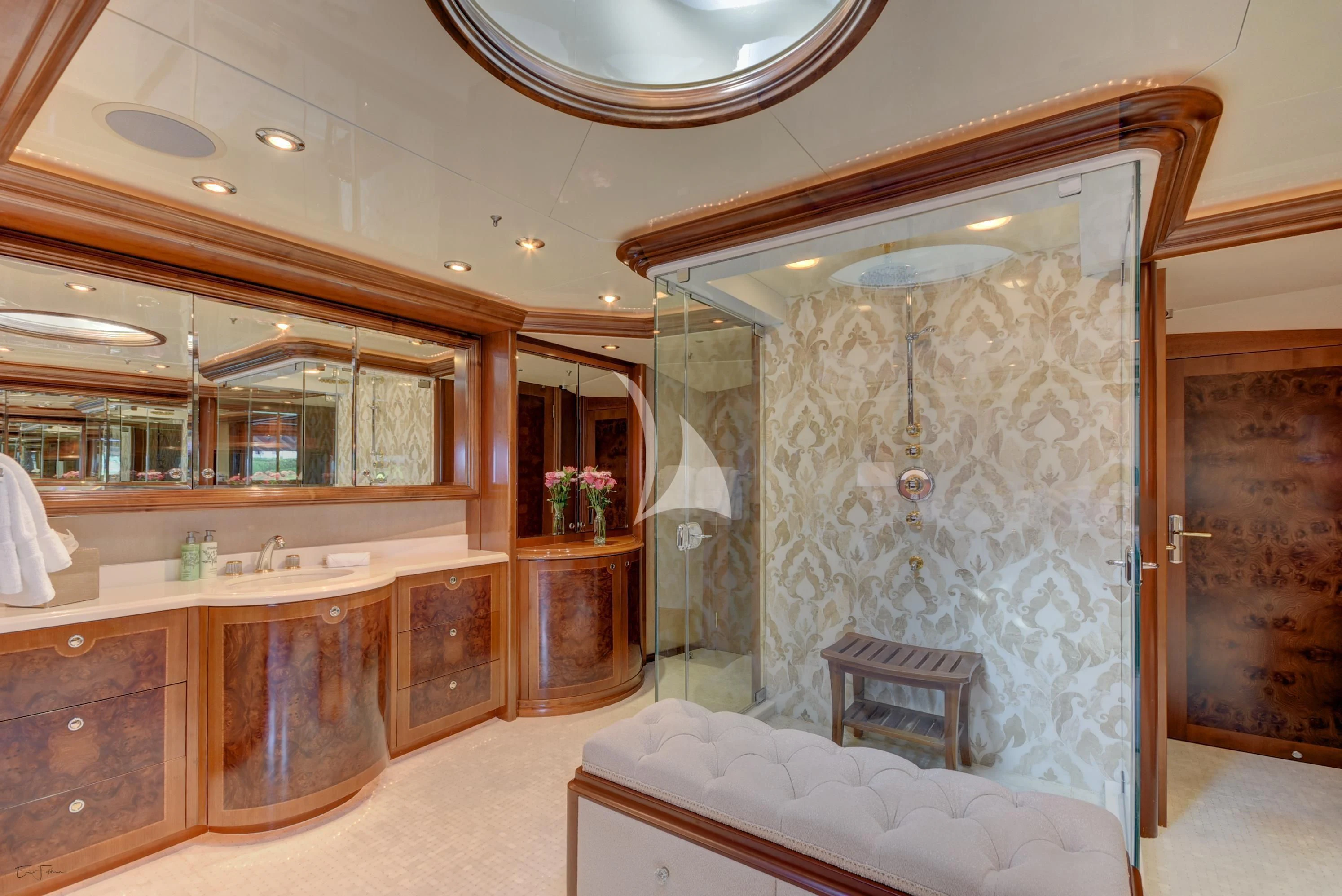 a large bathroom with a large mirror aboard CAMILLE Yacht for Sale