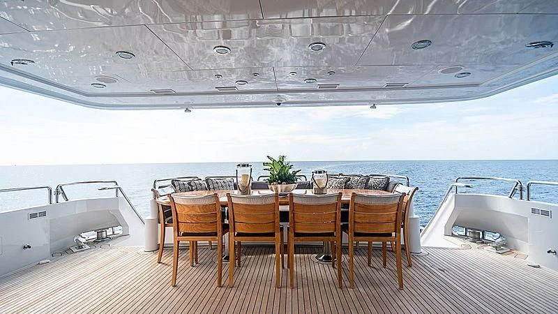 a table with chairs on it aboard CAMILLE Yacht for Sale