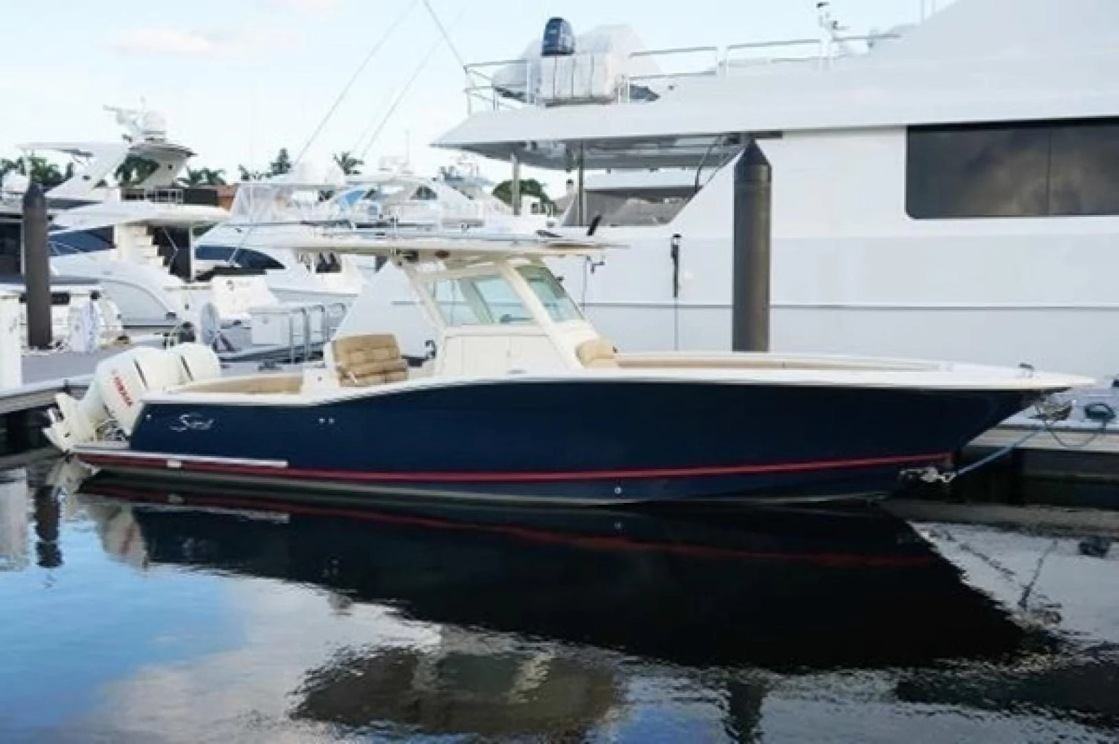 a group of boats are parked in a harbor aboard CAMILLE Yacht for Sale