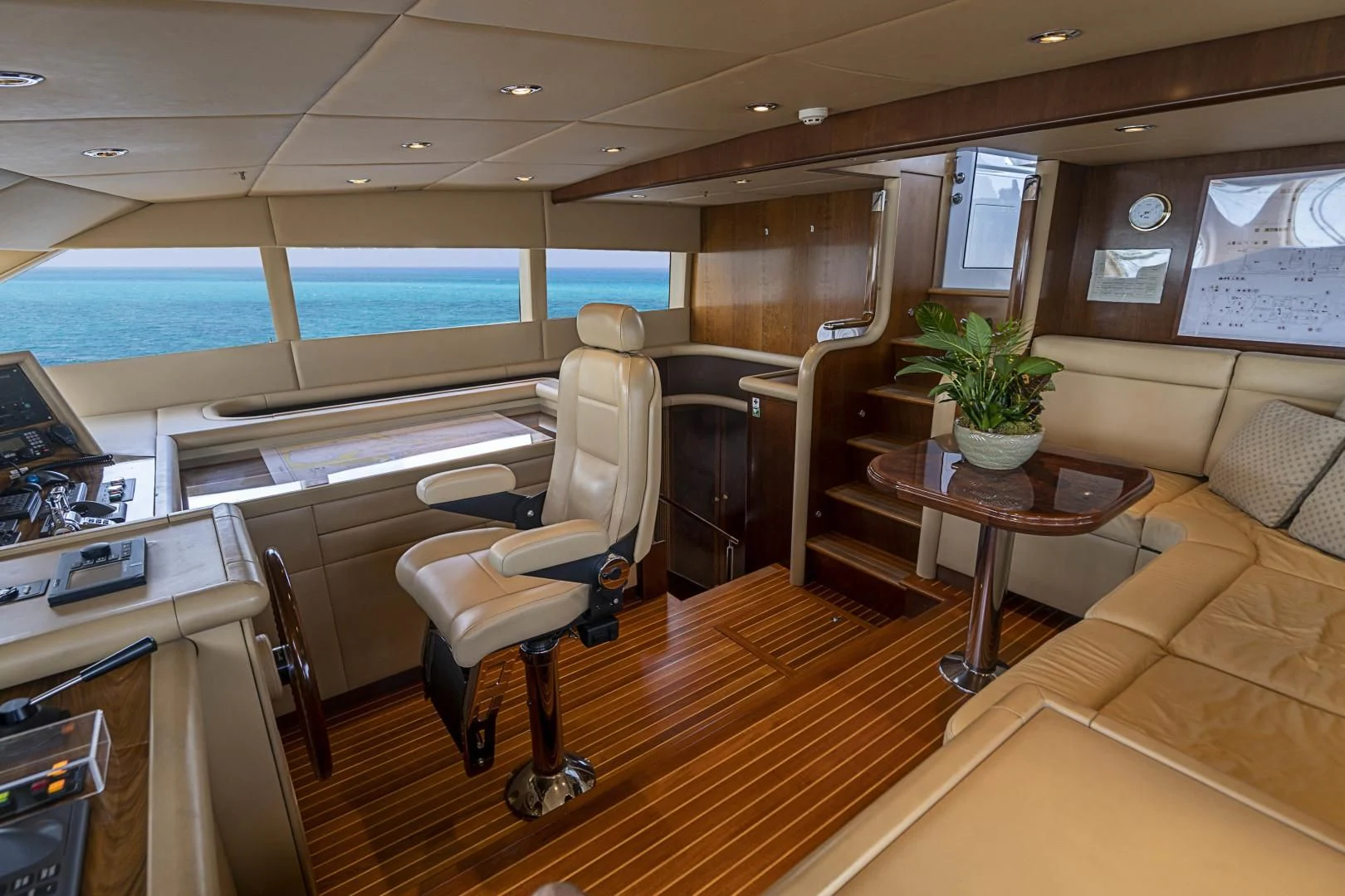 a room with a table and chairs aboard CAMILLE Yacht for Sale
