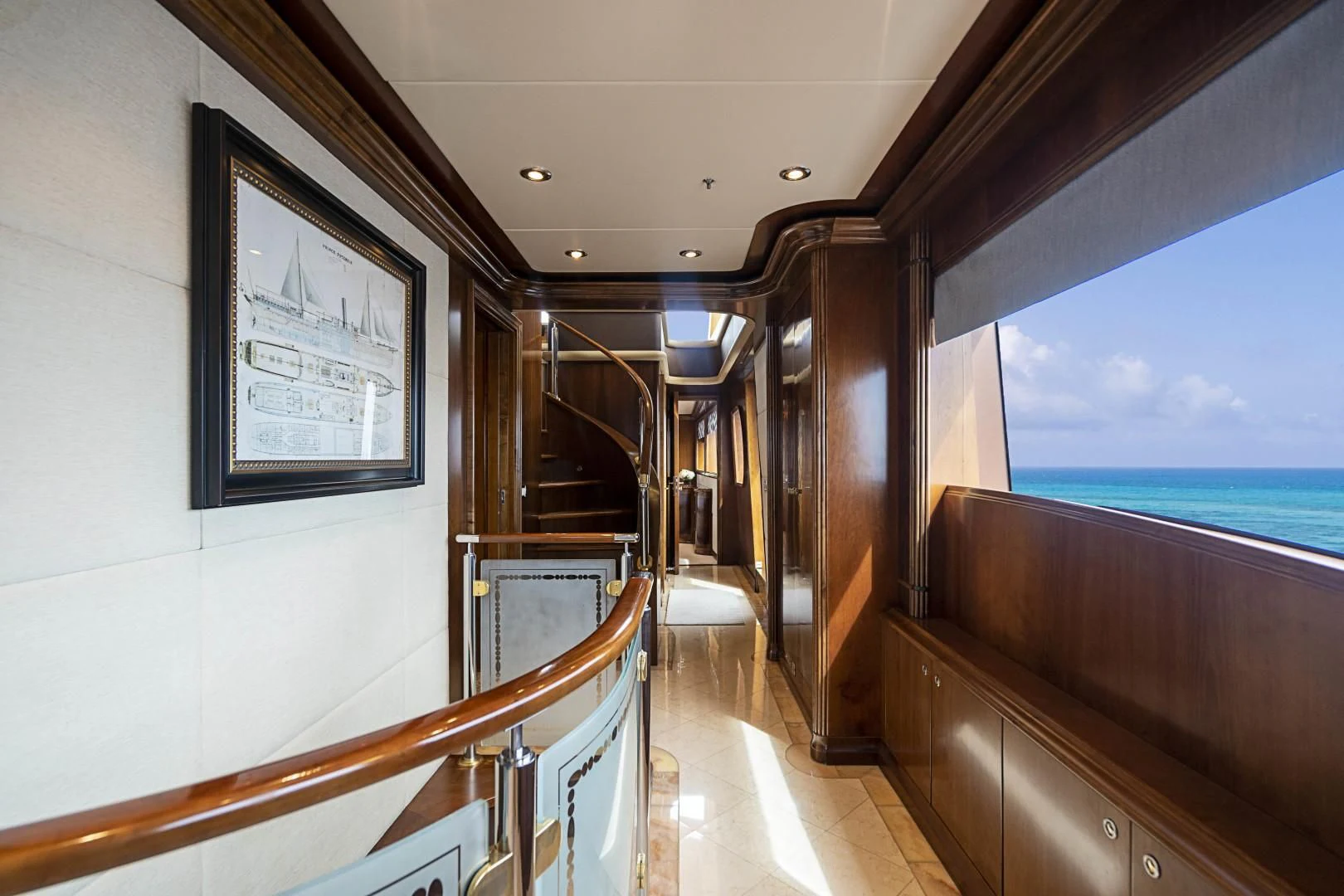 a room with a view of the ocean and the deck aboard CAMILLE Yacht for Sale
