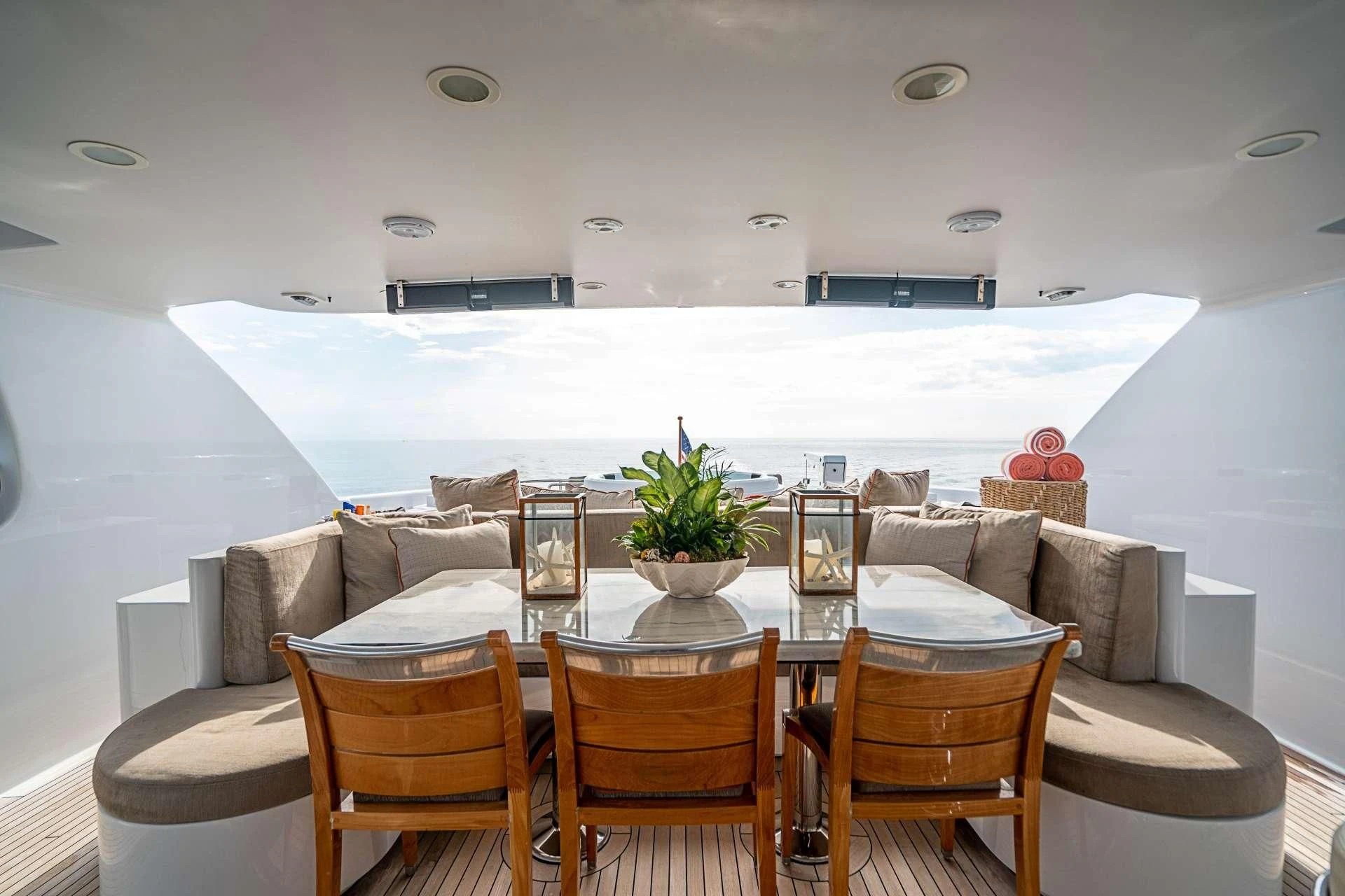 a room with a table and chairs aboard CAMILLE Yacht for Sale