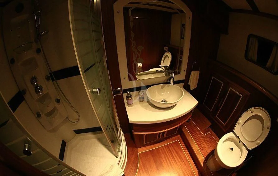 a bathroom with a glass shower aboard ESTRELLA DE MAR Yacht for Sale