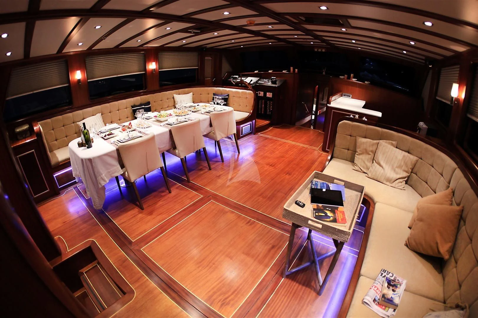 a living room with a couch and a table aboard ESTRELLA DE MAR Yacht for Sale