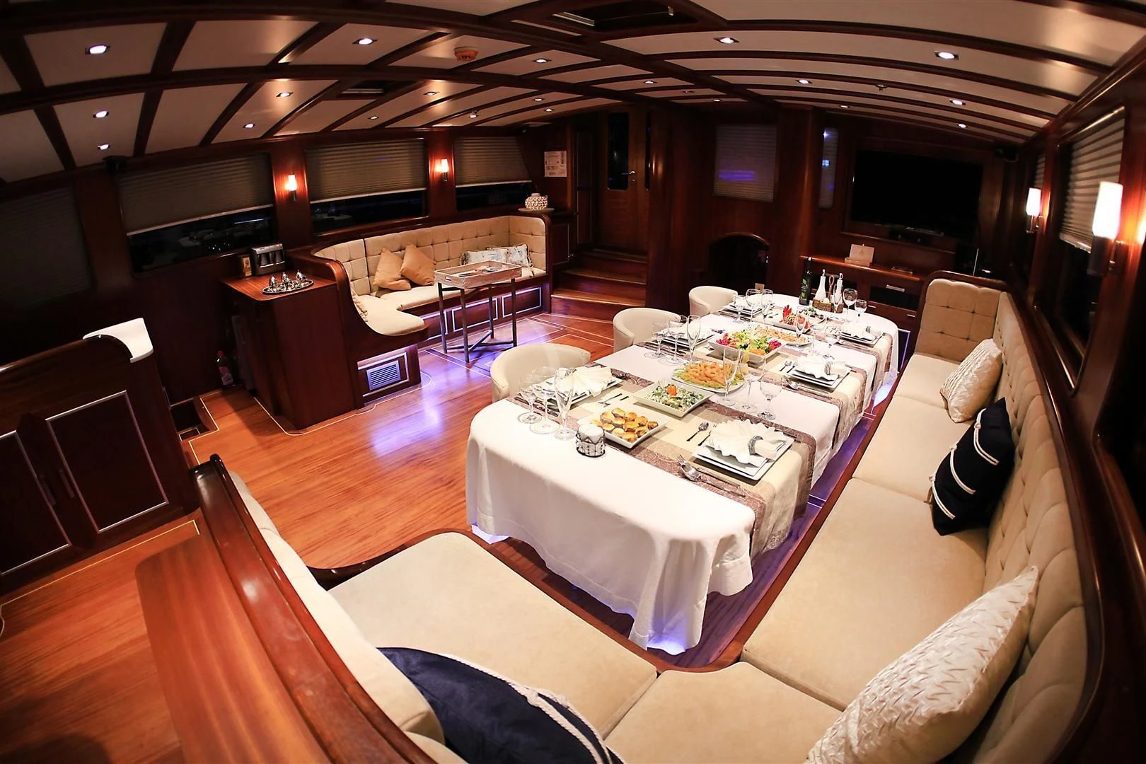a room with a table and chairs aboard ESTRELLA DE MAR Yacht for Sale