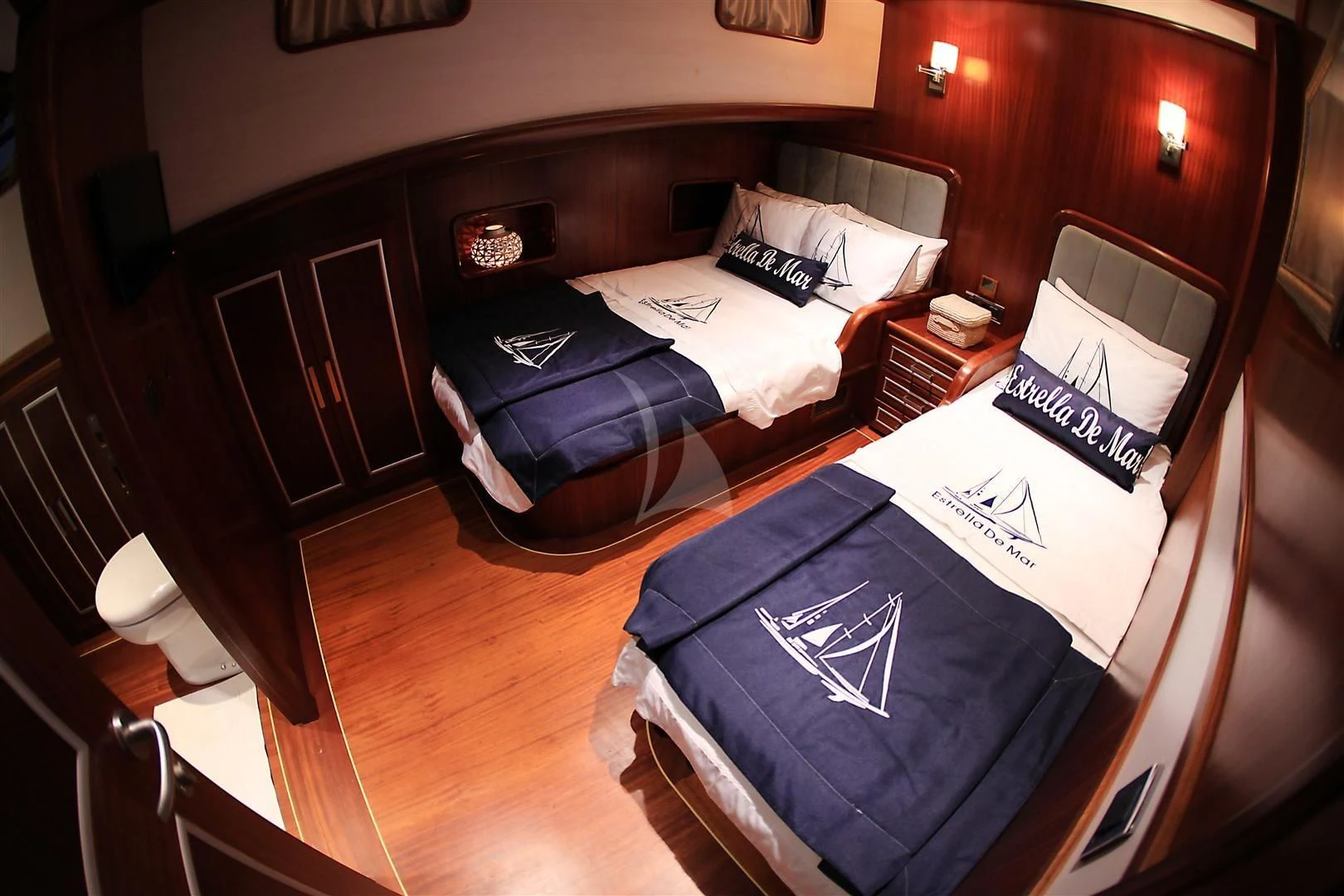 a room with a bed and a desk aboard ESTRELLA DE MAR Yacht for Sale