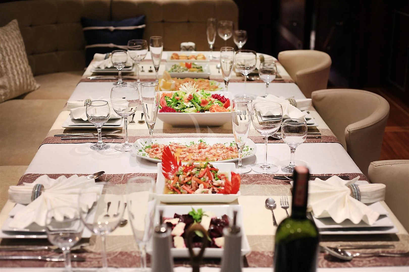 a table with food and wine aboard ESTRELLA DE MAR Yacht for Sale