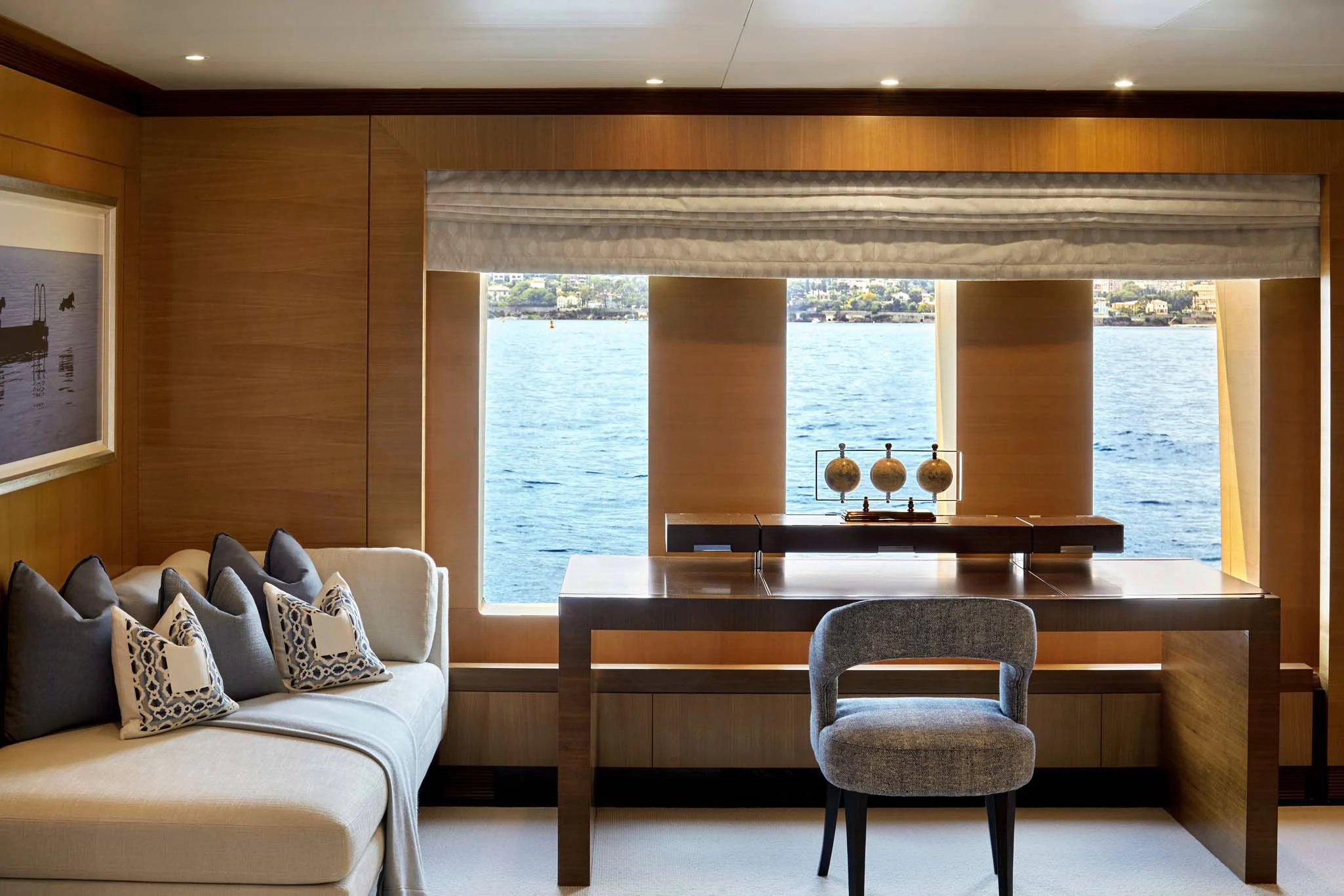 a room with a couch and a table and a window aboard LA BLANCA Yacht for Sale