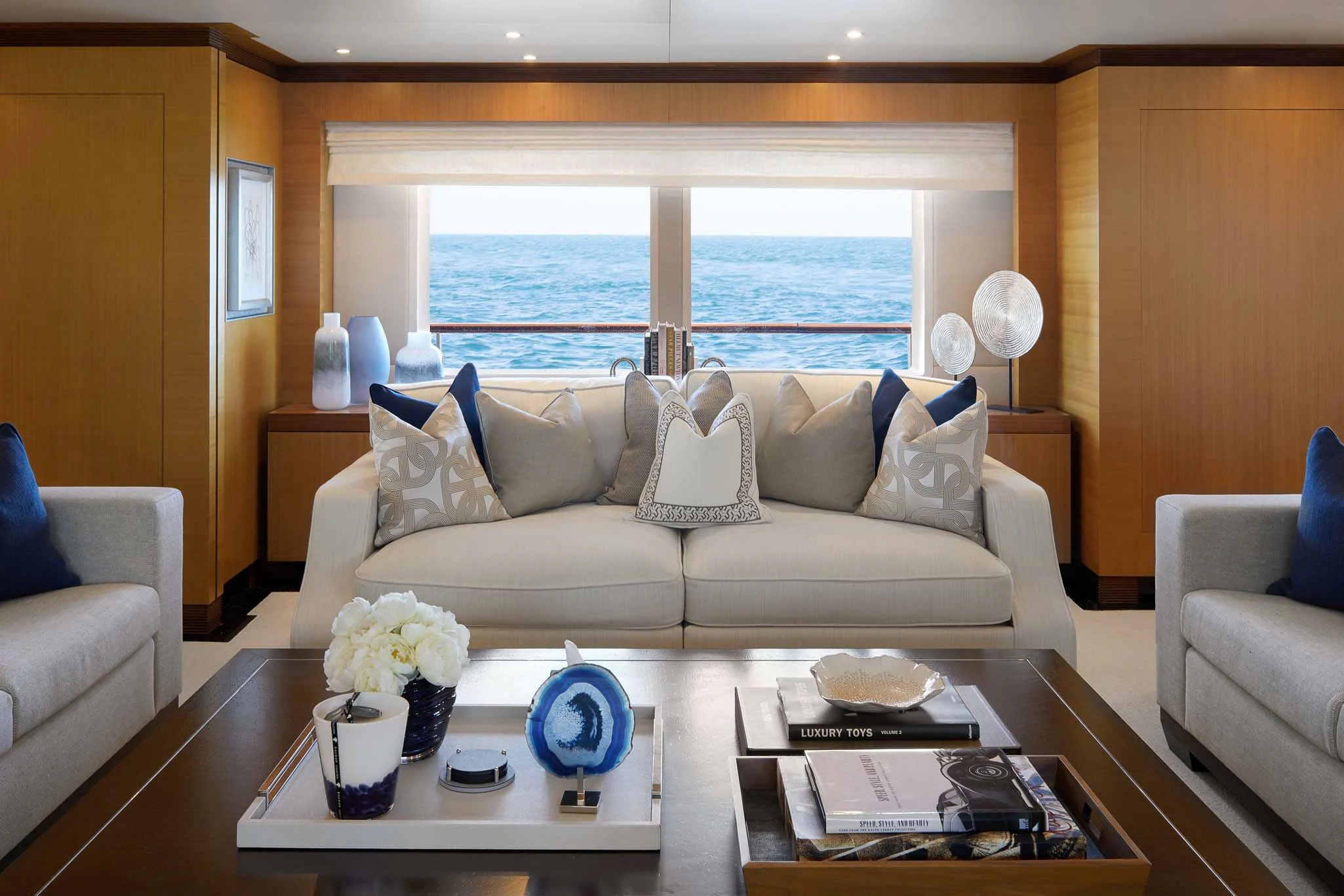 a living room with a large window aboard LA BLANCA Yacht for Sale