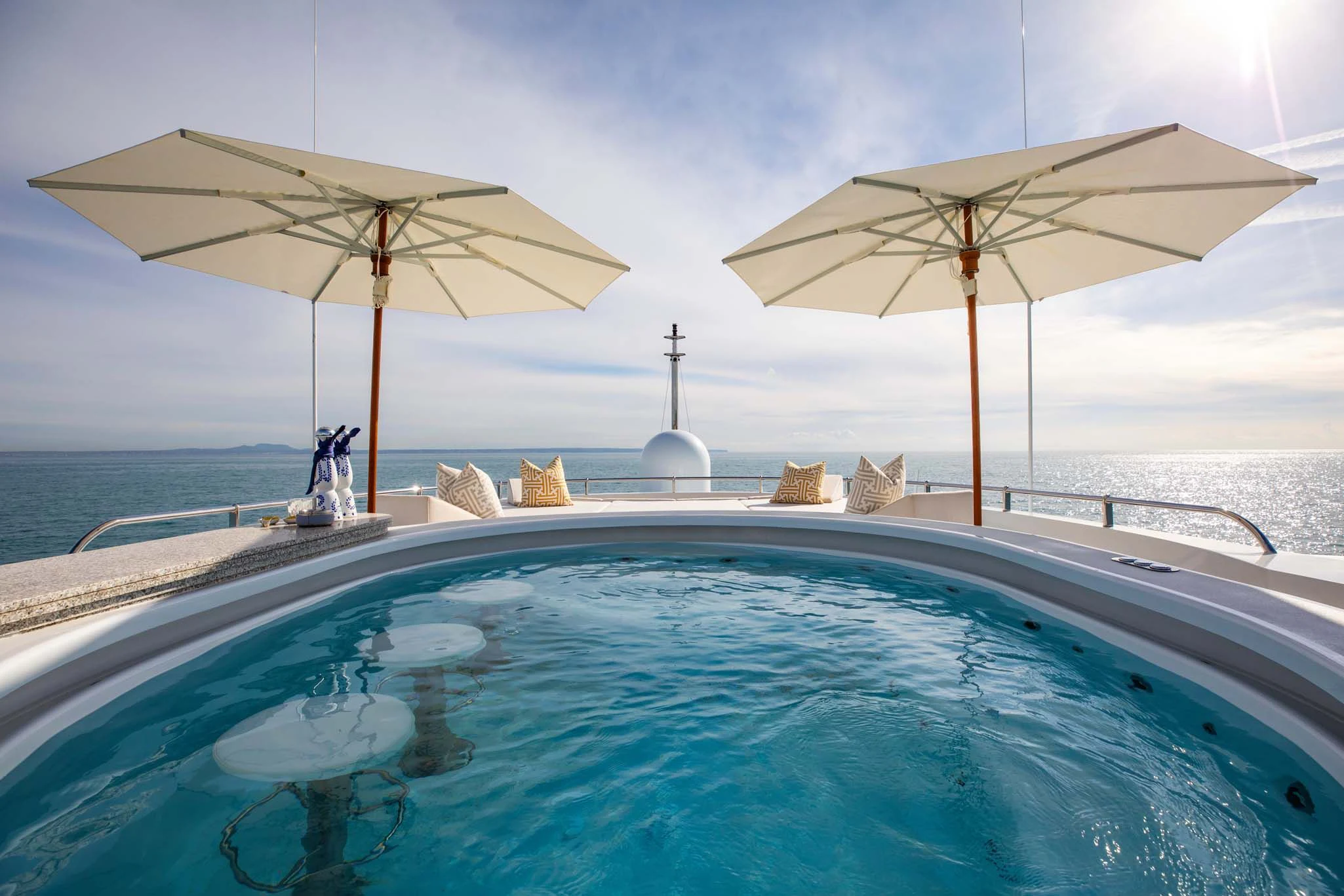 a pool with umbrellas aboard LA BLANCA Yacht for Sale
