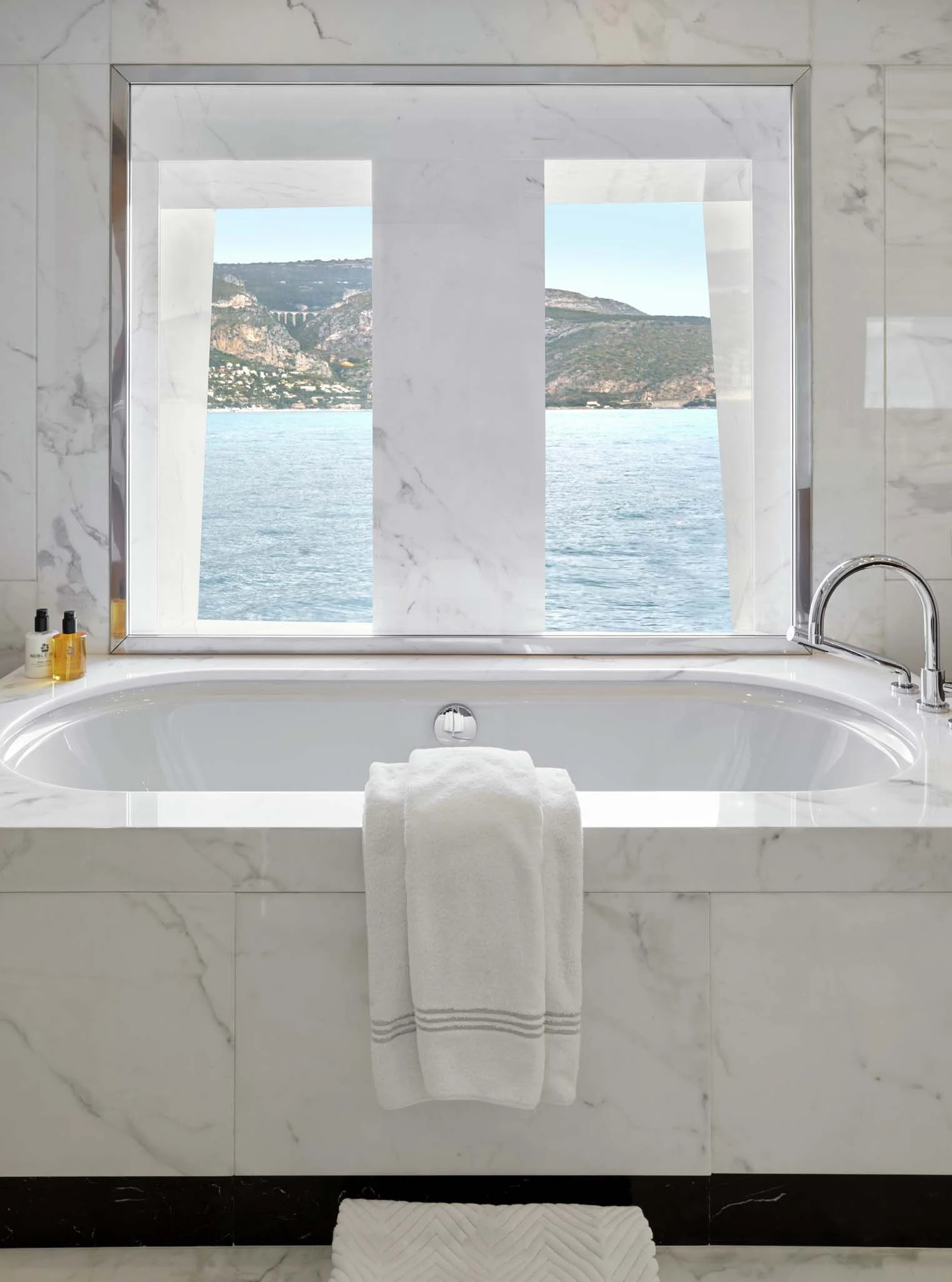 a bathtub with a large window aboard LA BLANCA Yacht for Sale