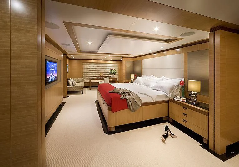 a bedroom with a large bed aboard LA BLANCA Yacht for Sale