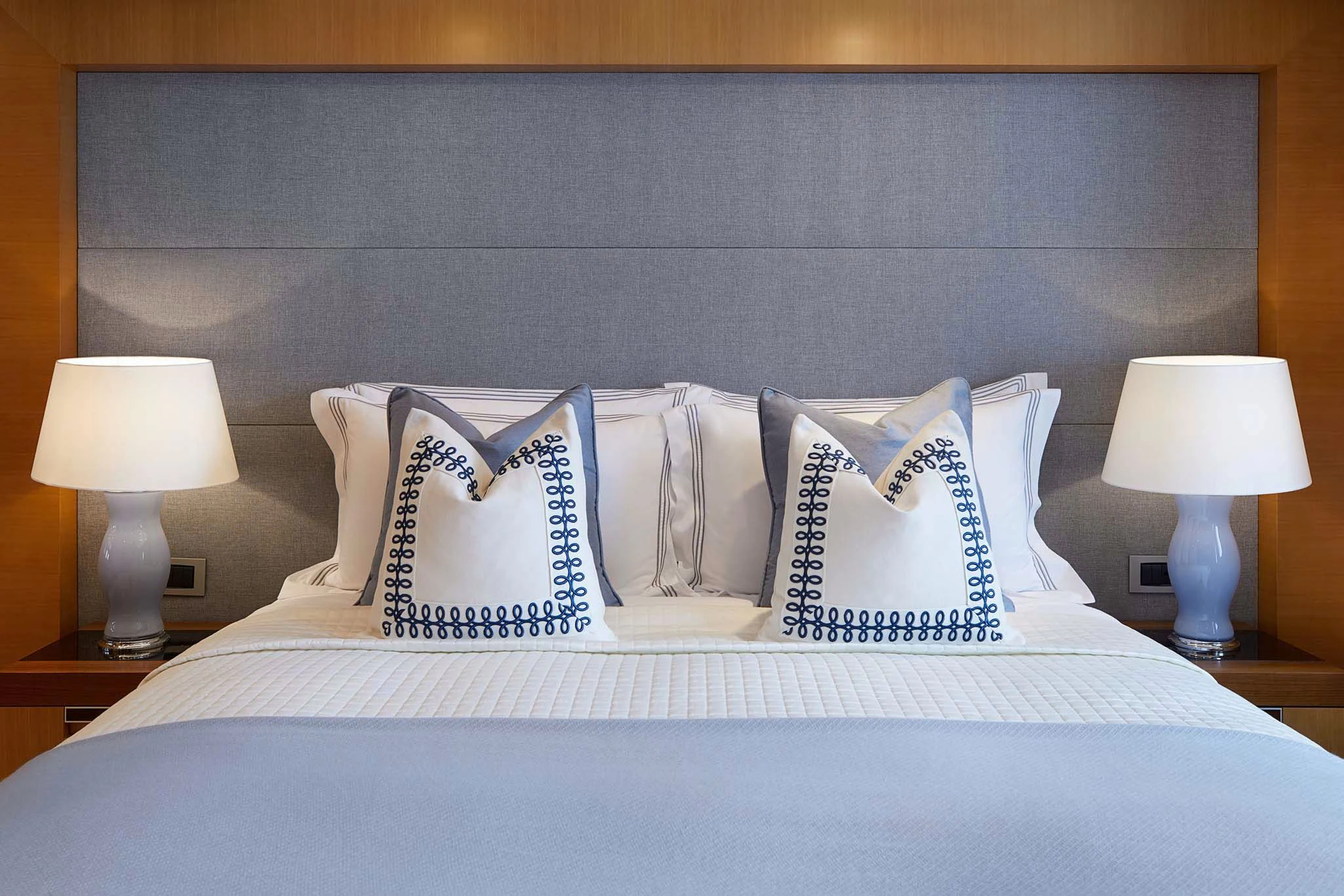 a bed with white sheets and pillows aboard LA BLANCA Yacht for Sale