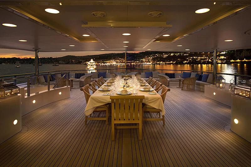 a large room with tables and chairs aboard LA BLANCA Yacht for Sale