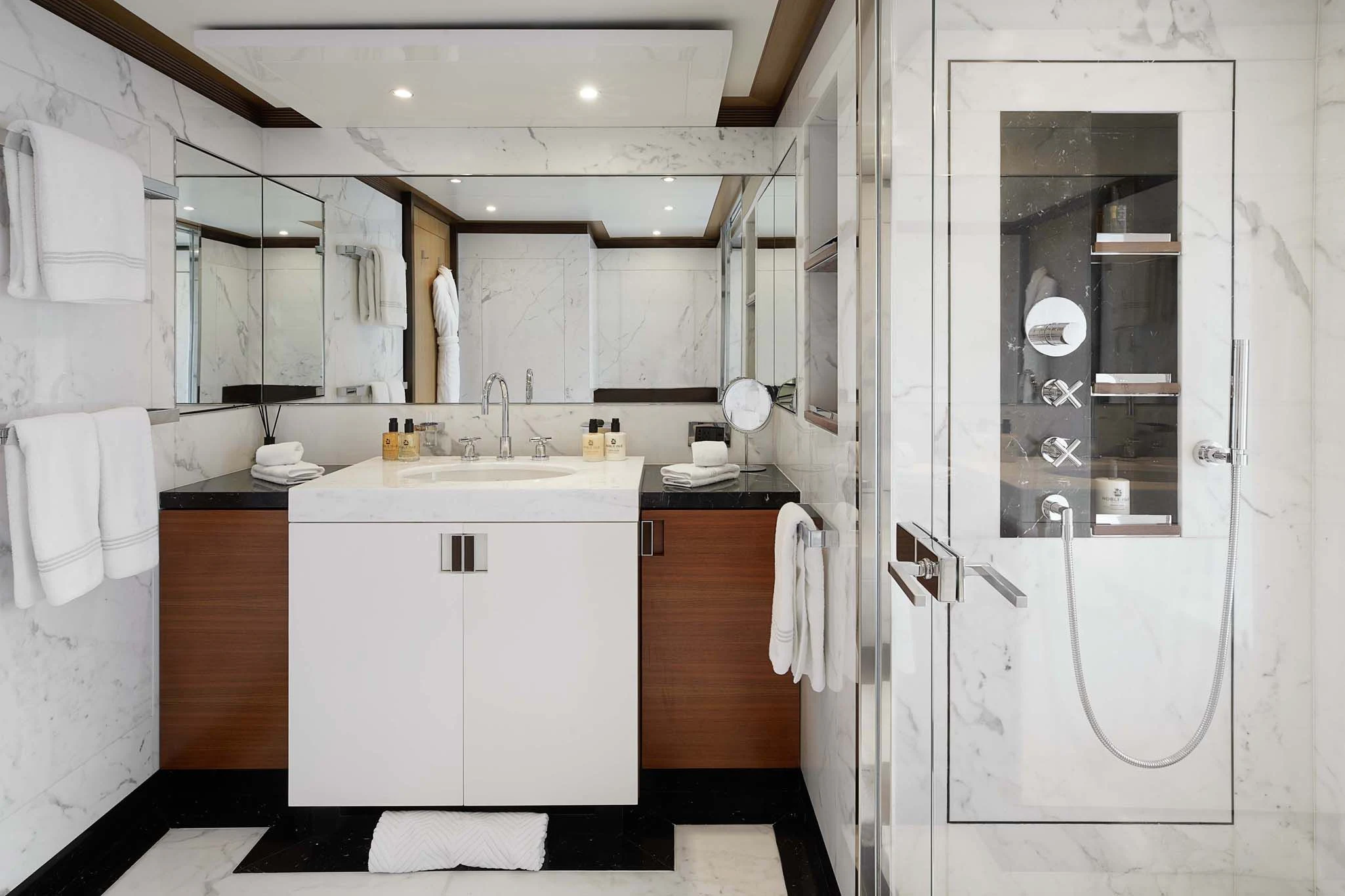 a bathroom with a sink and a mirror aboard LA BLANCA Yacht for Sale