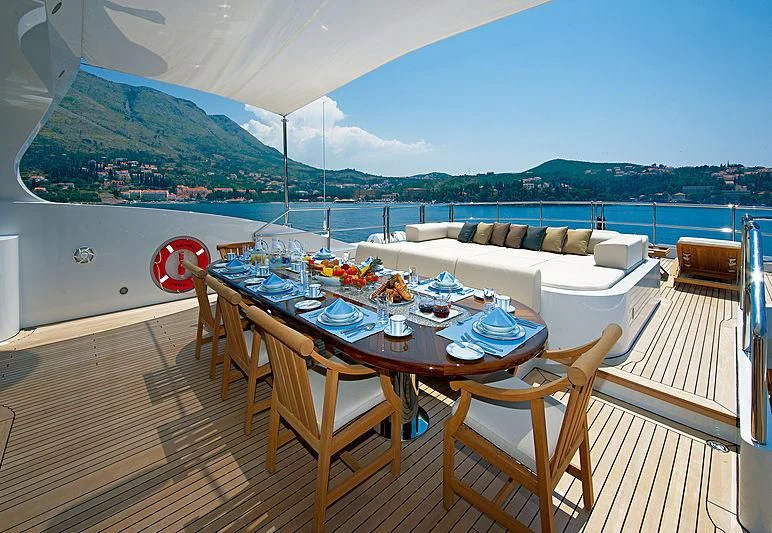 a table on a deck aboard LA BLANCA Yacht for Sale