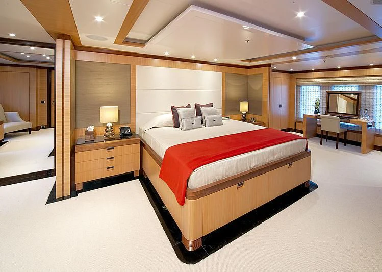 a large bed in a hotel room aboard LA BLANCA Yacht for Sale