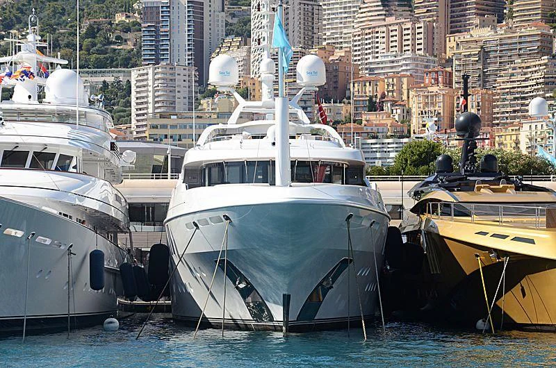 several boats docked in a harbor aboard LA BLANCA Yacht for Sale