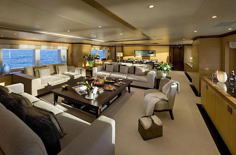 a living room with a large screen aboard LA BLANCA Yacht for Sale