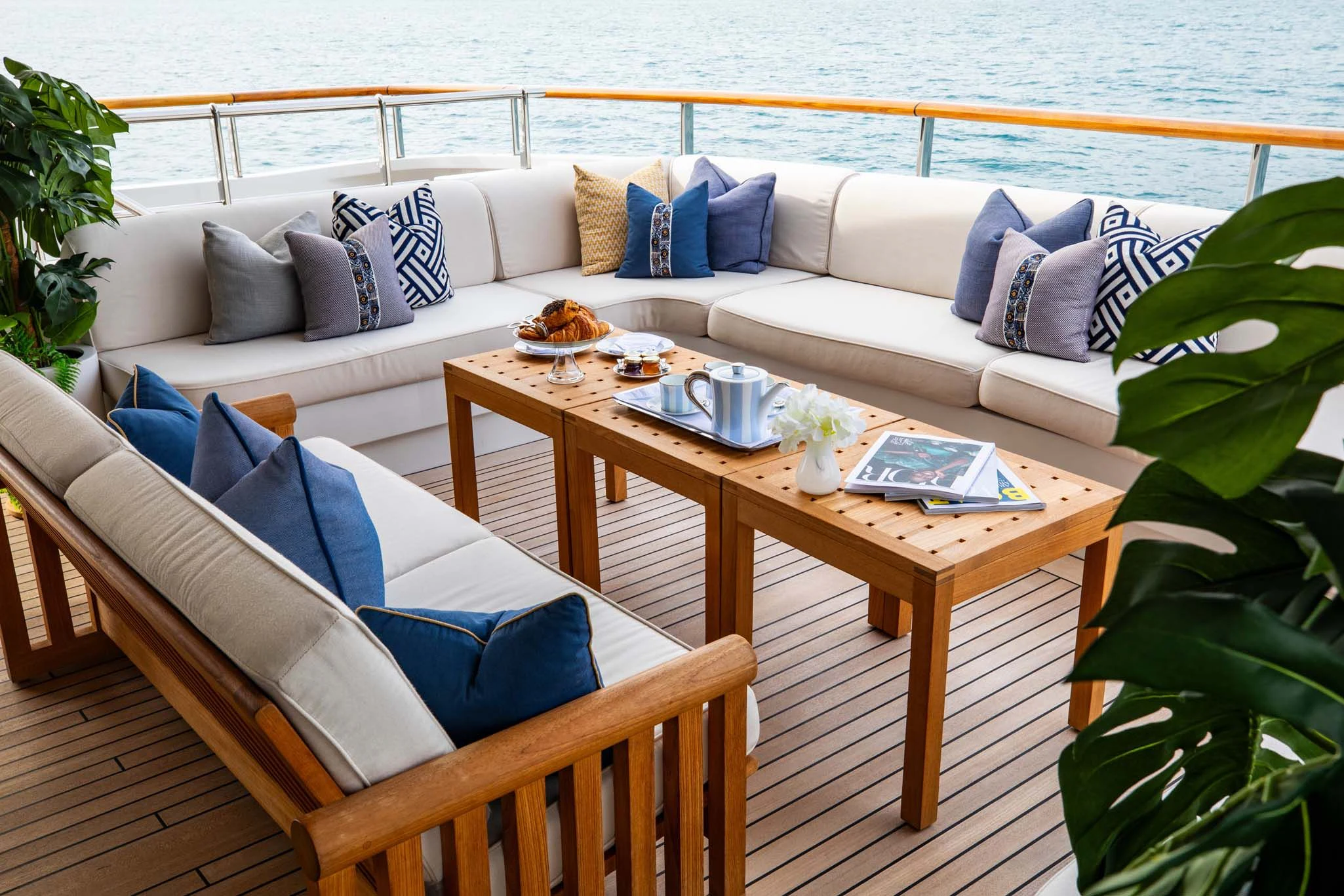a table with a couch and a chair on it aboard LA BLANCA Yacht for Sale