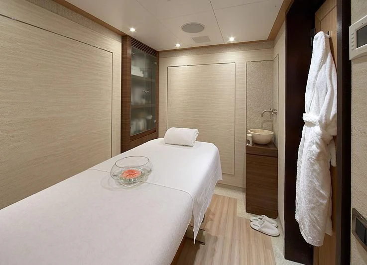 a bed and a table in a room aboard LA BLANCA Yacht for Sale