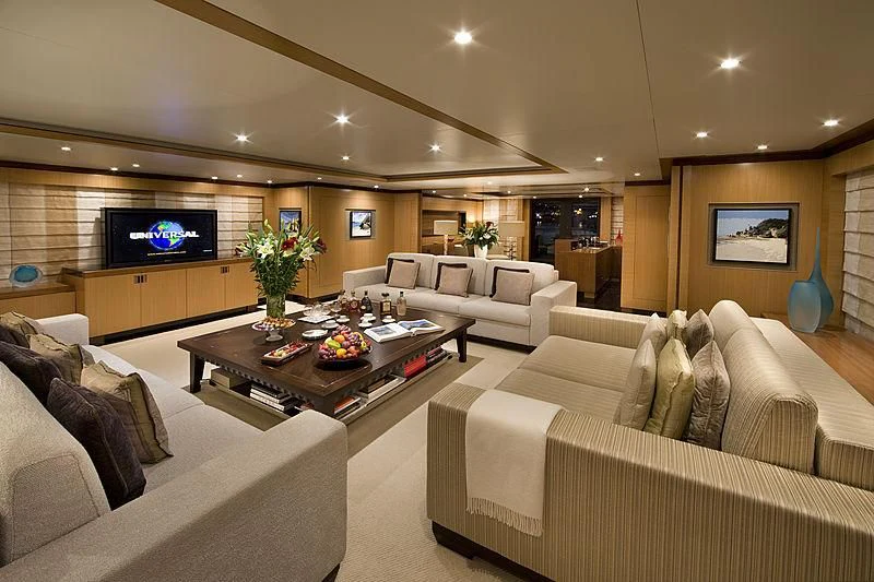 a living room with a couch and a tv aboard LA BLANCA Yacht for Sale
