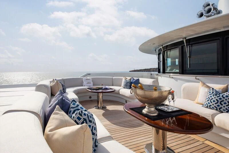 a living room with a large window aboard LA BLANCA Yacht for Sale