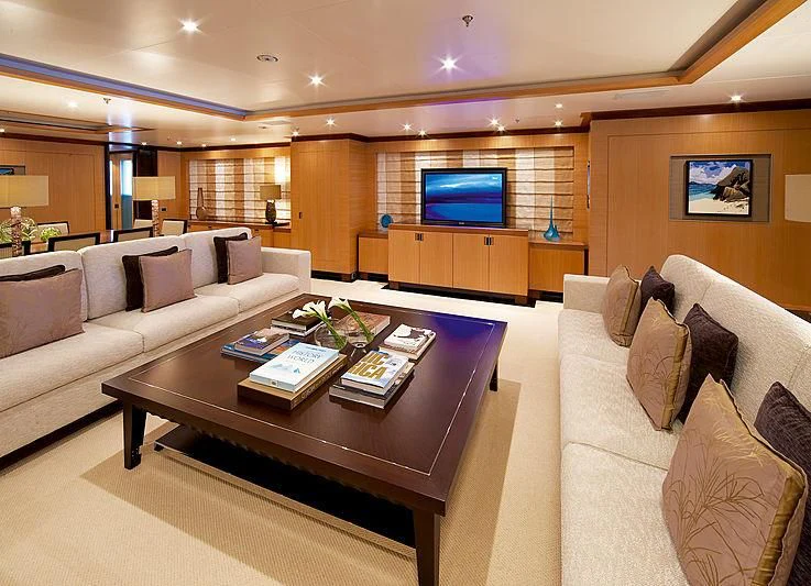 a living room with a large screen aboard LA BLANCA Yacht for Sale