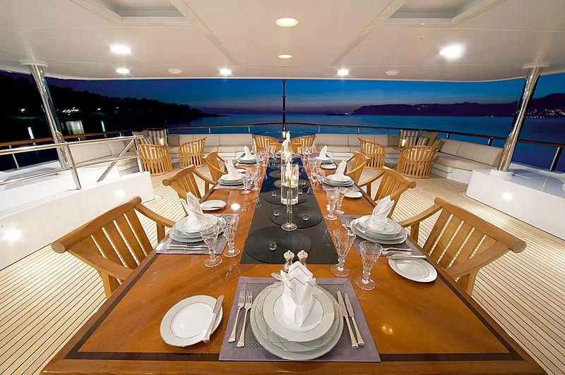 a table set for a dinner party aboard LA BLANCA Yacht for Sale