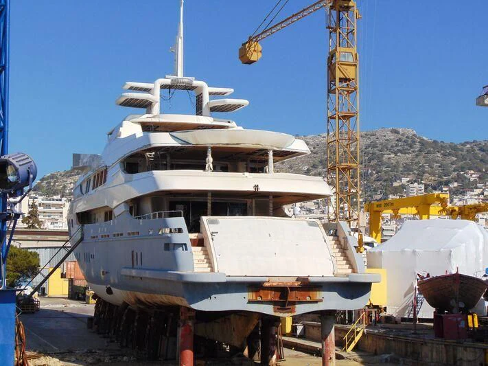 a large white ship docked aboard BLUE DESIRE Yacht for Sale