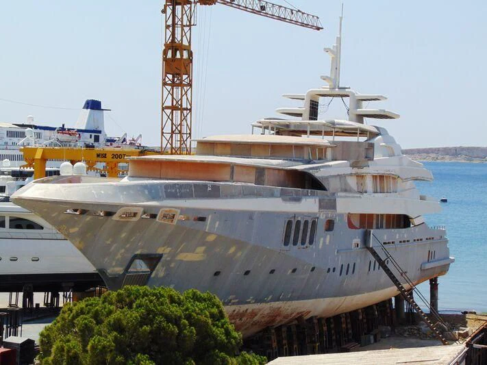 a large white ship docked aboard BLUE DESIRE Yacht for Sale