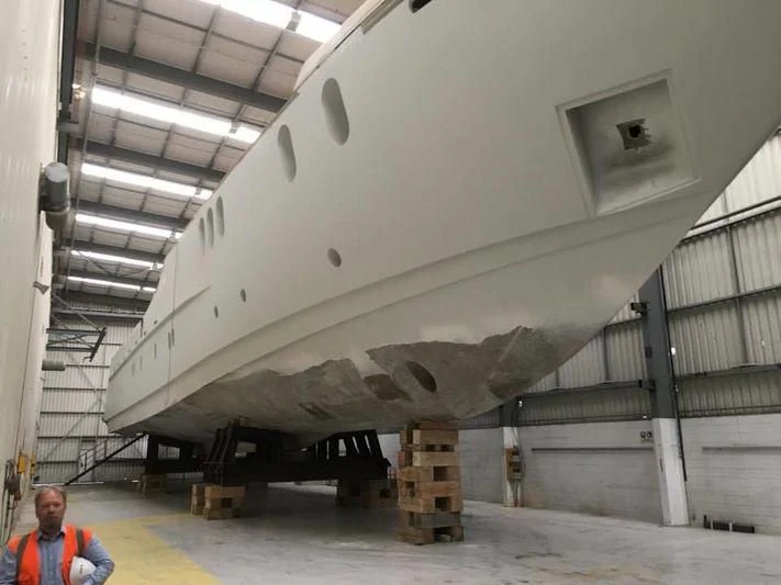 a person standing next to a large tank aboard SENSATION YACHTS SY32 Yacht for Sale