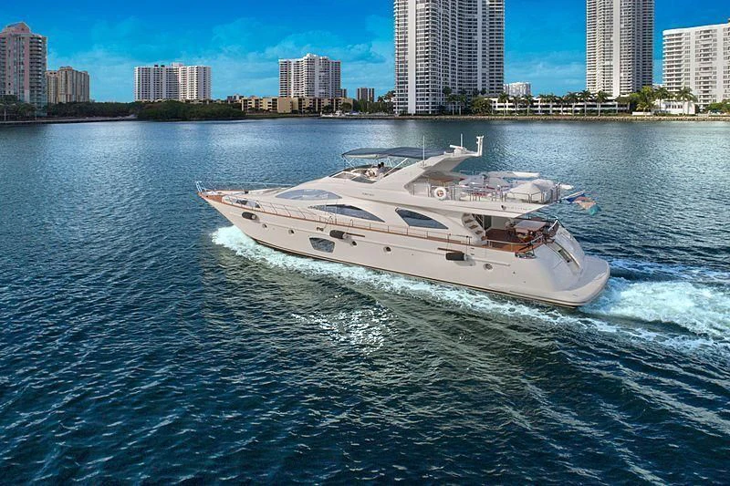 a white yacht on the water aboard PURA VIDA Yacht for Sale