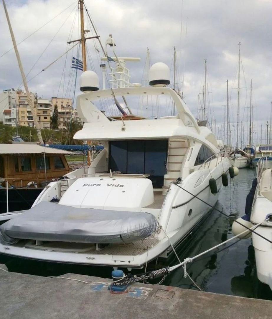 a boat docked at a pier aboard PURA VIDA Yacht for Sale