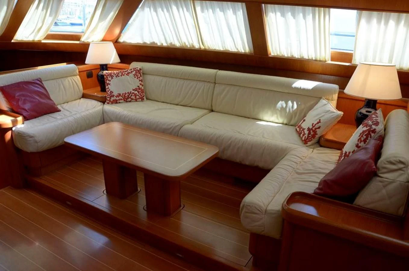 a living room with a couch and a table aboard STARFALL Yacht for Sale